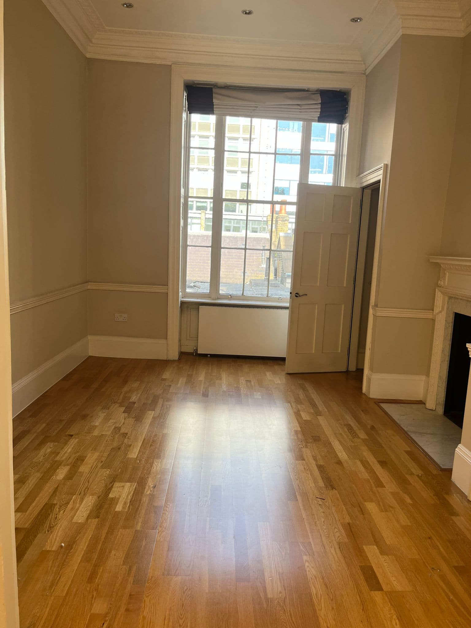 Period reception room with parquet flooring cleaned and polished after cleaning